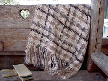 A rich natural colored mohair throw