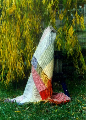 Image of the throw draped over the cider press