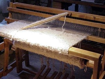 one of the side panels being woven